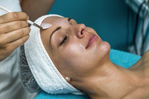 Woman getting a facial peel