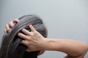 women combs through thick hair