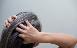 women combs through thick hair