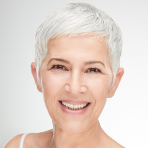 short white haired woman smiling