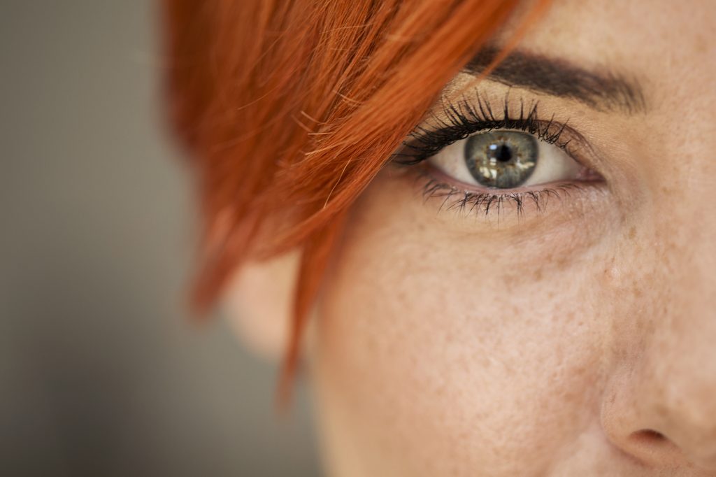 Close up of a woman's face with freckles