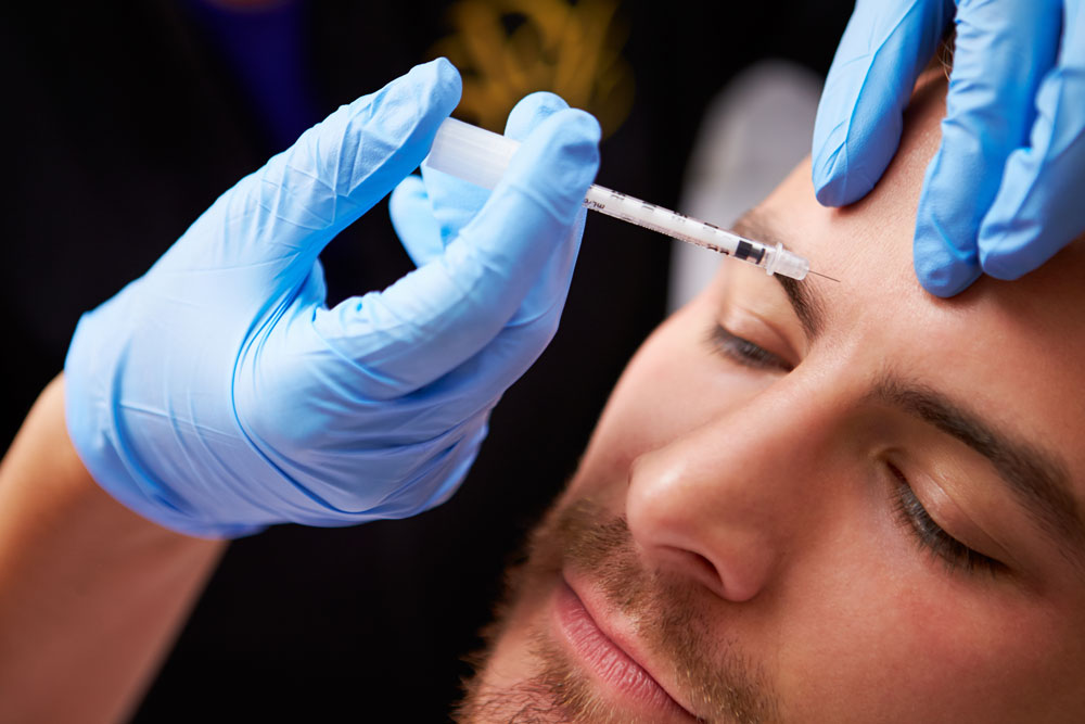 Man receiving Scupltra injection to reduce wrinkles