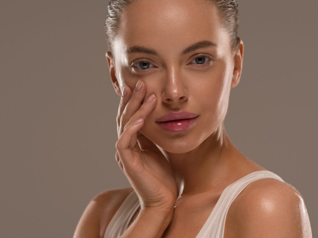 woman smiling after plastic surgery