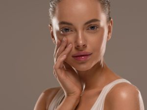 woman smiling after plastic surgery