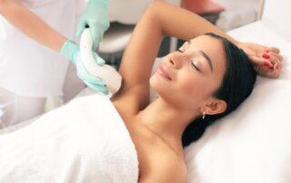 woman gets laser hair removal on her armpits