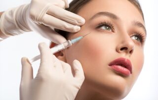 woman gets botox injected by her eye