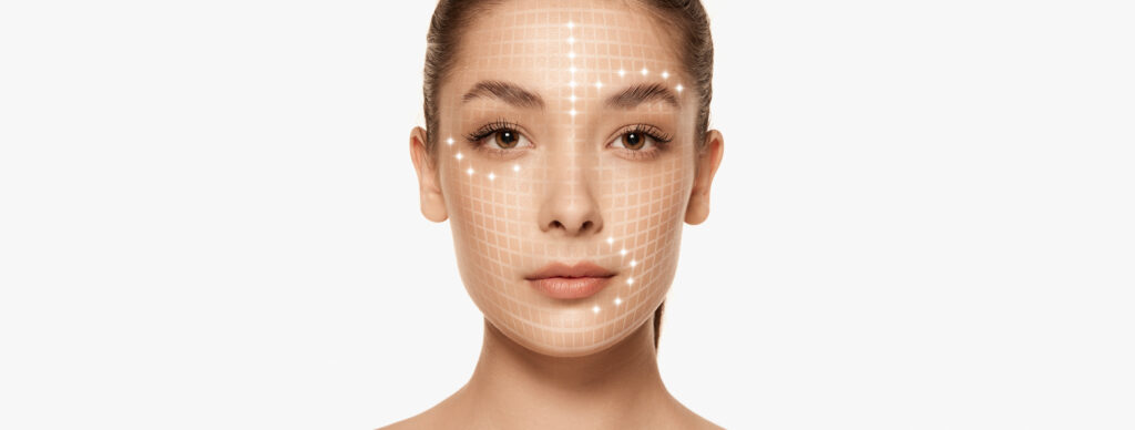 A woman with face mapping to show potential areas for cosmetic surgery.